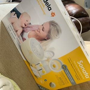 Brand new in box Medela Sonata pump.